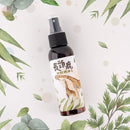 深棕色噴霧瓶，標籤印有長頸鹿插畫和中文防蚊字樣.