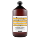 棕色塑膠瓶裝達芬尼斯保濕滋潤洗髮露1000ml，白色標籤黃色條紋設計.