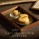 法式國王太陽餅禮盒六入裝，金黃酥脆餅皮，內餡層次分明，擺放於木質托盤中.