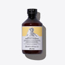 Davines達芬尼斯黑色瓶身250ml去屑洗髮露，白黃色標籤設計.