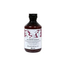達芬尼斯彈潤洗髮露250ml，深色塑膠瓶身搭白底紫色花卉標籤.