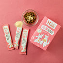 粉紅色包裝的狗貓心臟保健品，三包小袋及一碗顆粒狀補充品.