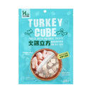 藍綠色包裝火雞立方凍乾貓咪零食，透明視窗可見凍乾肉塊.
