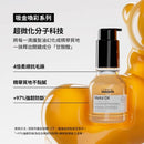 透明金色護髮油瓶配黑色泵頭，瓶身標籤印有Loreal絲漾博品牌名和產品信息.