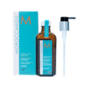 Moroccanoil摩洛哥優油清爽型免沖洗護髮油100ml，透明棕色瓶身配有黑色壓頭.